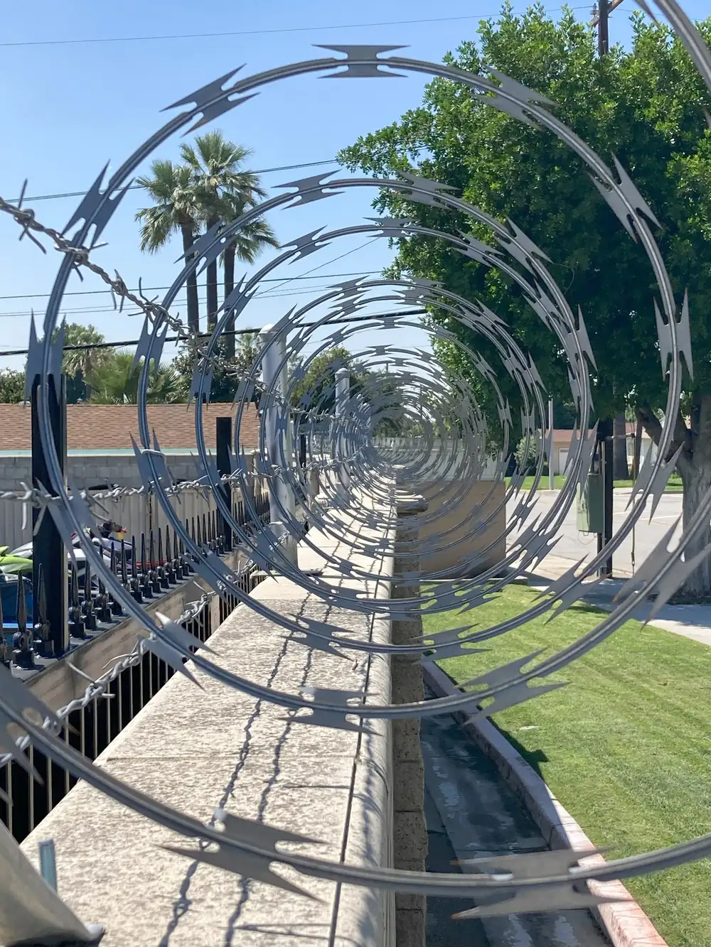 Security fence with razor wire built by Fence-X-Ellent